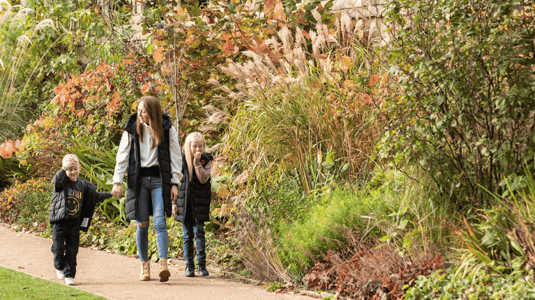 Visitors in the garden at Halloween at Hardwick Hall, Derbyshire